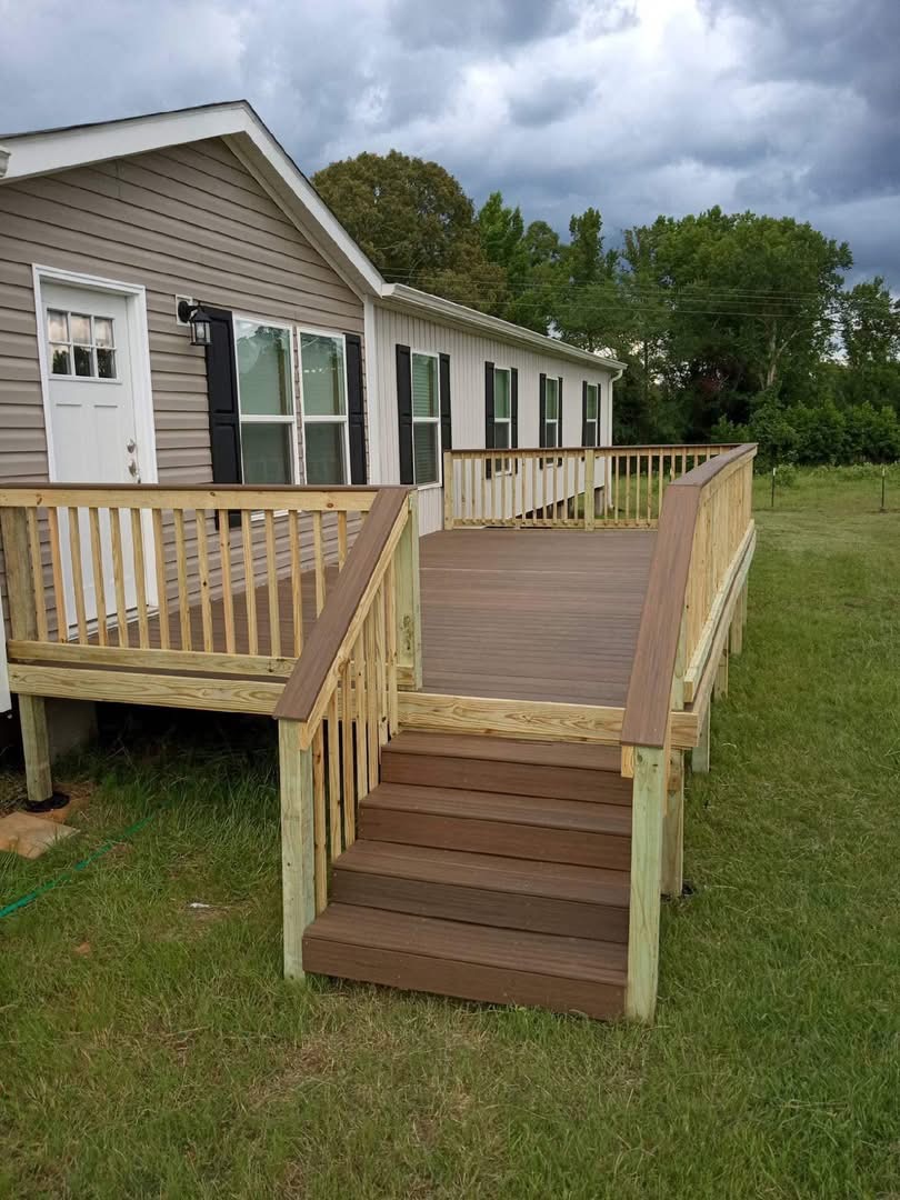 Mobile home deck with composite boards, stairs and accessibility ramp